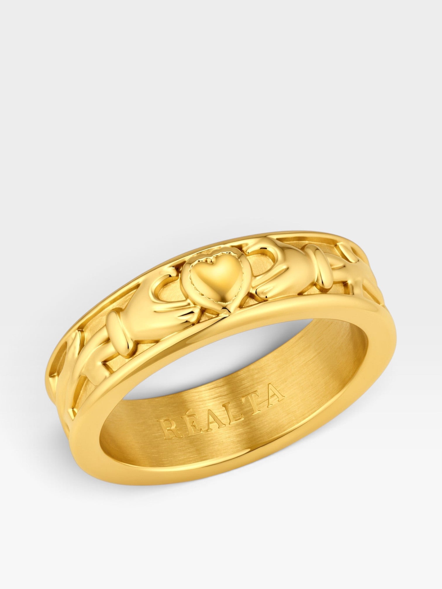 Réalta gold plated stainless steel Claddagh band ring featuring traditional heart and hands design