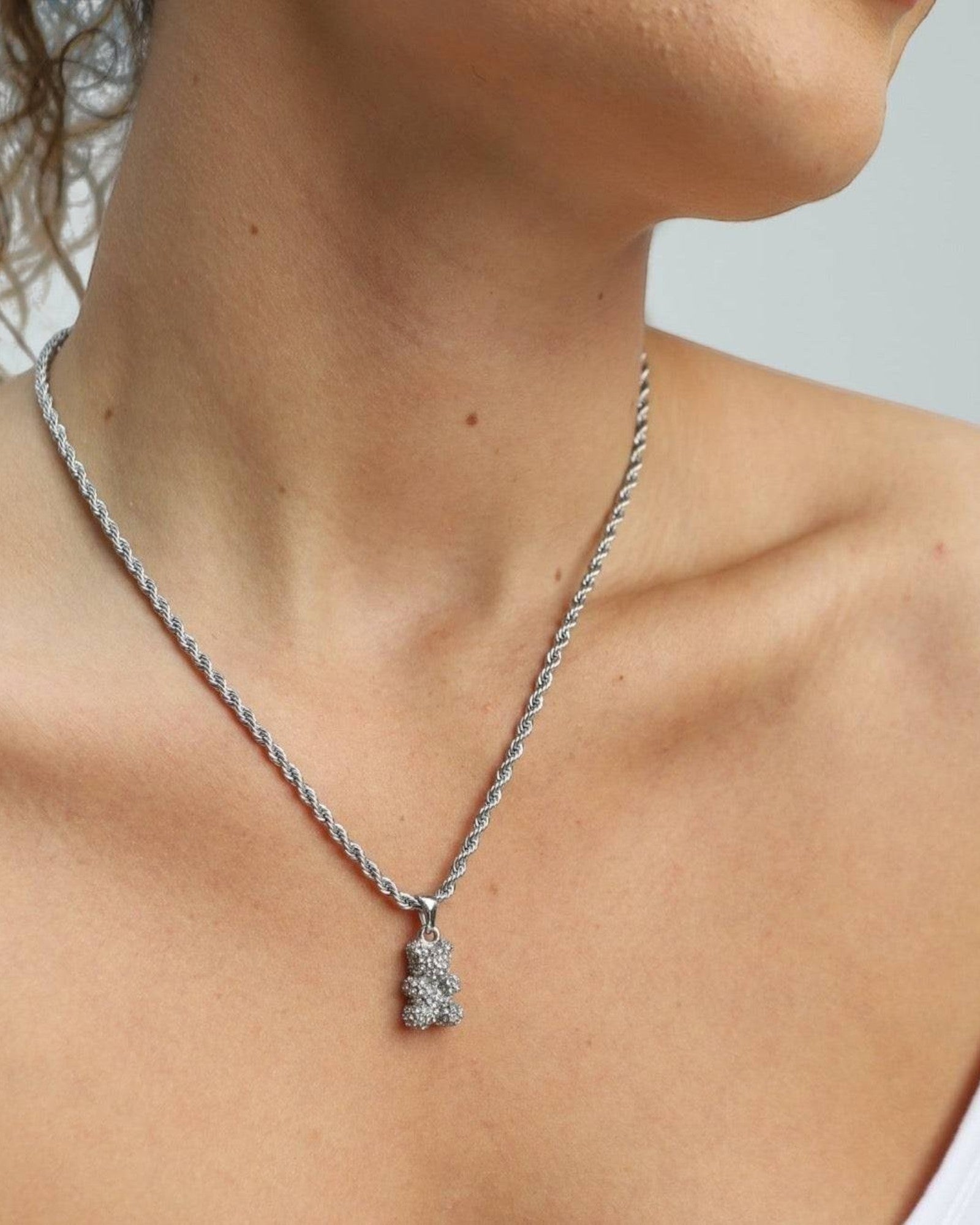 Réalta pavé bear pendant necklace in silver stainless steel worn on a delicate rope chain