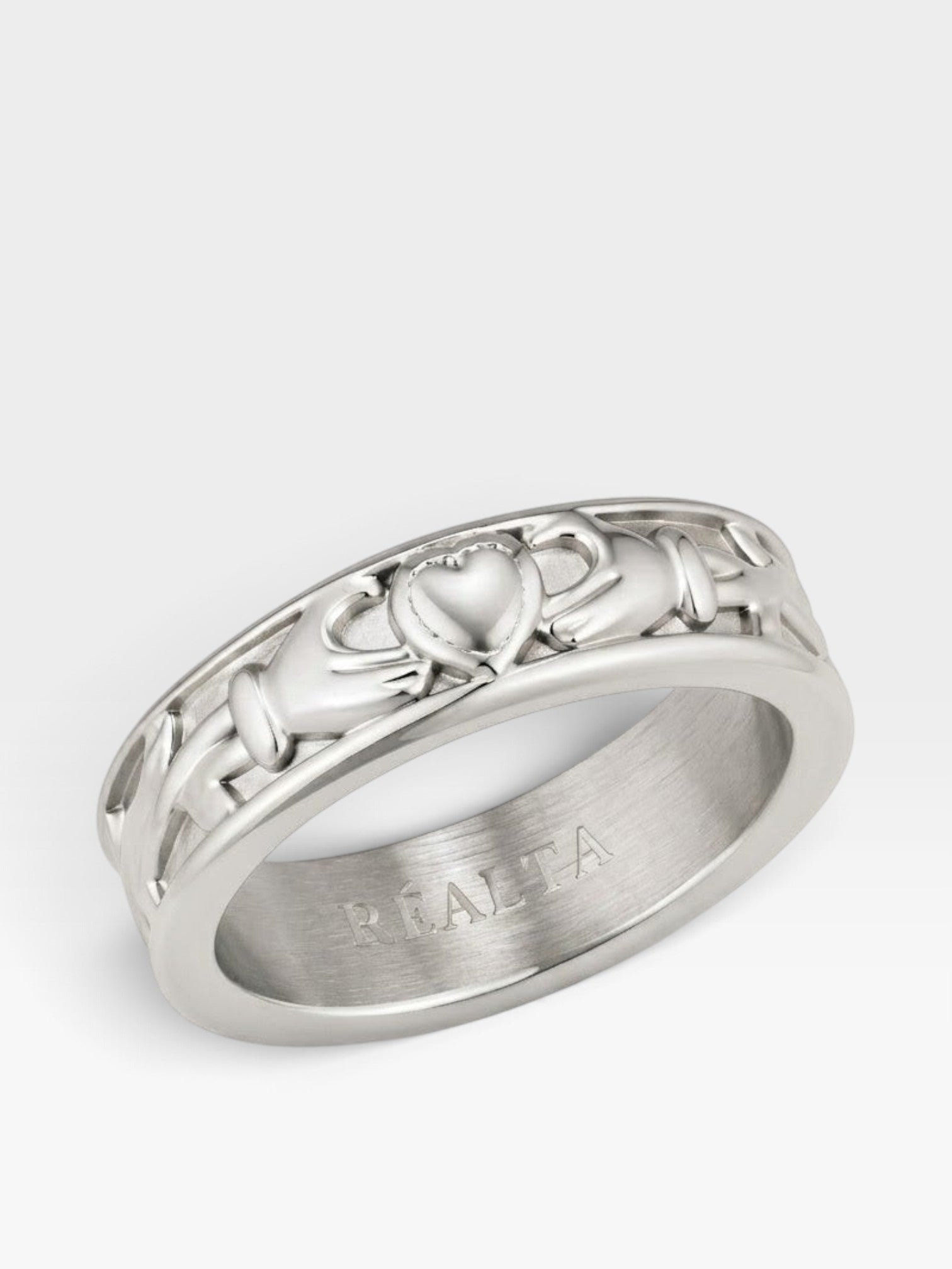Réalta silver-toned stainless steel Claddagh band ring featuring traditional heart, hands, and crown design.